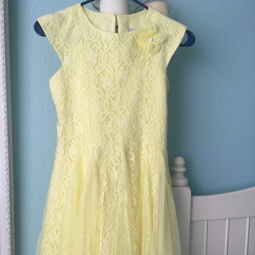 Girl’s bright yellow lace dress